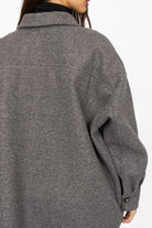Back view of gray BJORA Overshirt in wool blend with oversized fit and buttoned cuff.