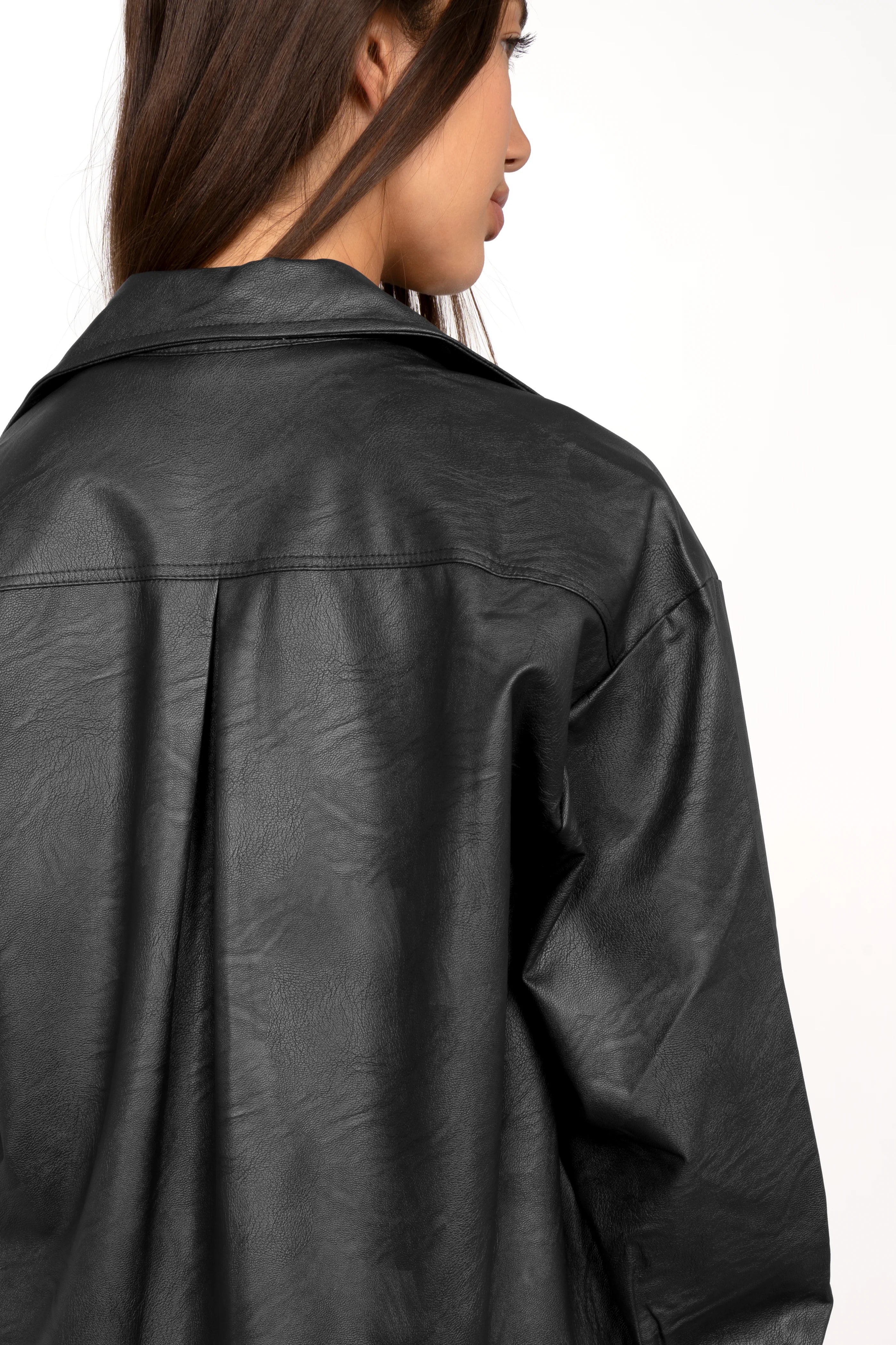 Back view of black cropped SOOAE shirt jacket made from supersoft eco-leather with Kent collar and slightly dropped shoulders