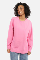 EIREL oversize sweater with soft cotton, round neckline, dropped shoulders, ribbed cuffs, rounded hem, tonal logo embroidery, A-line silhouette, and oversize fit.