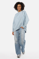 EIREL Oversize Sweater in soft cotton with round neckline, dropped shoulders, ribbed cuffs, rounded hem, tonal logo embroidery, A-line shape, and oversized fit.