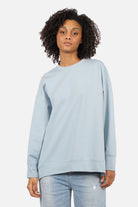 EIREL Oversize Sweater in soft cotton with round neckline, dropped shoulders, ribbed cuffs, rounded hem, tonal logo embroidery, A-line fit, and oversized silhouette.