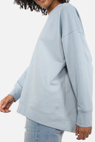 EIREL oversize sweater in soft cotton with round neckline, dropped shoulders, ribbed cuffs, rounded hem, tonal logo embroidery, A-line silhouette in size S worn by 1.75m model