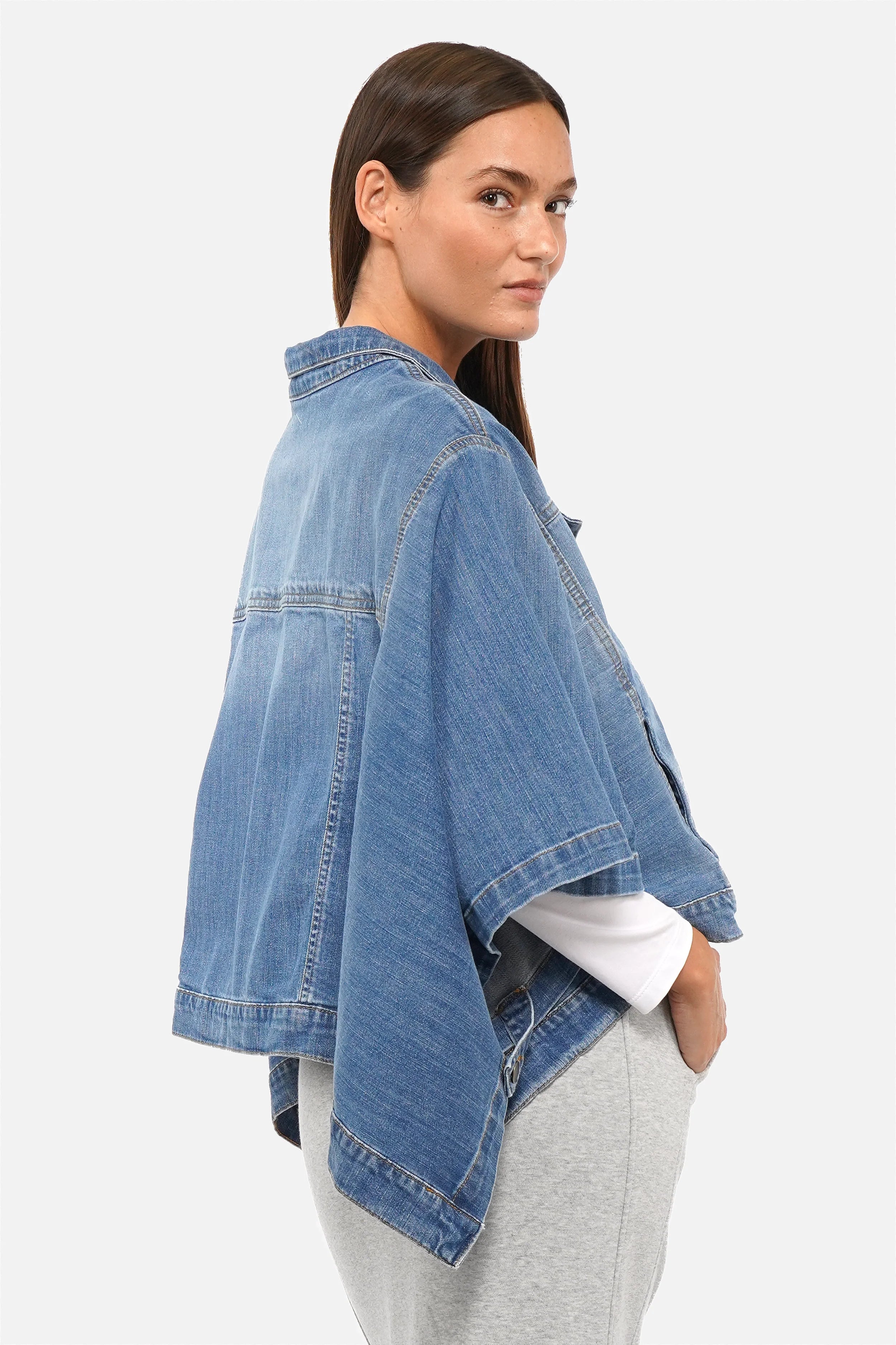FIBI Denim Cape with classic collar and button front made from soft stretchy Italian denim