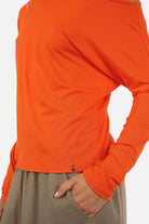 Woman wearing FRYA One Shoulder longsleeve with asymmetrical neckline and batwing sleeves