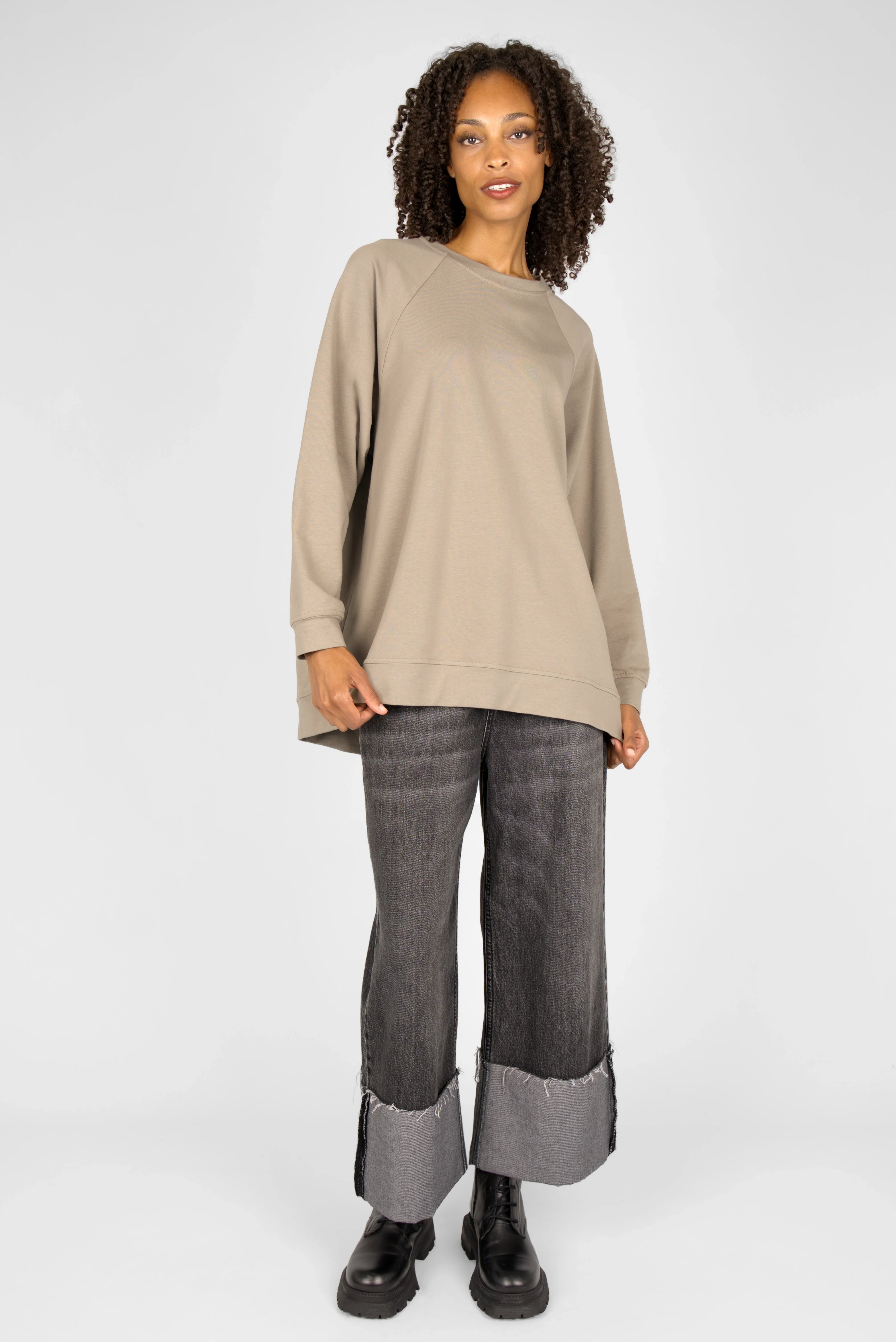 GRACEY.K Sweater in beige oversized fit with rounded hem and tonal logo embroidery worn by model