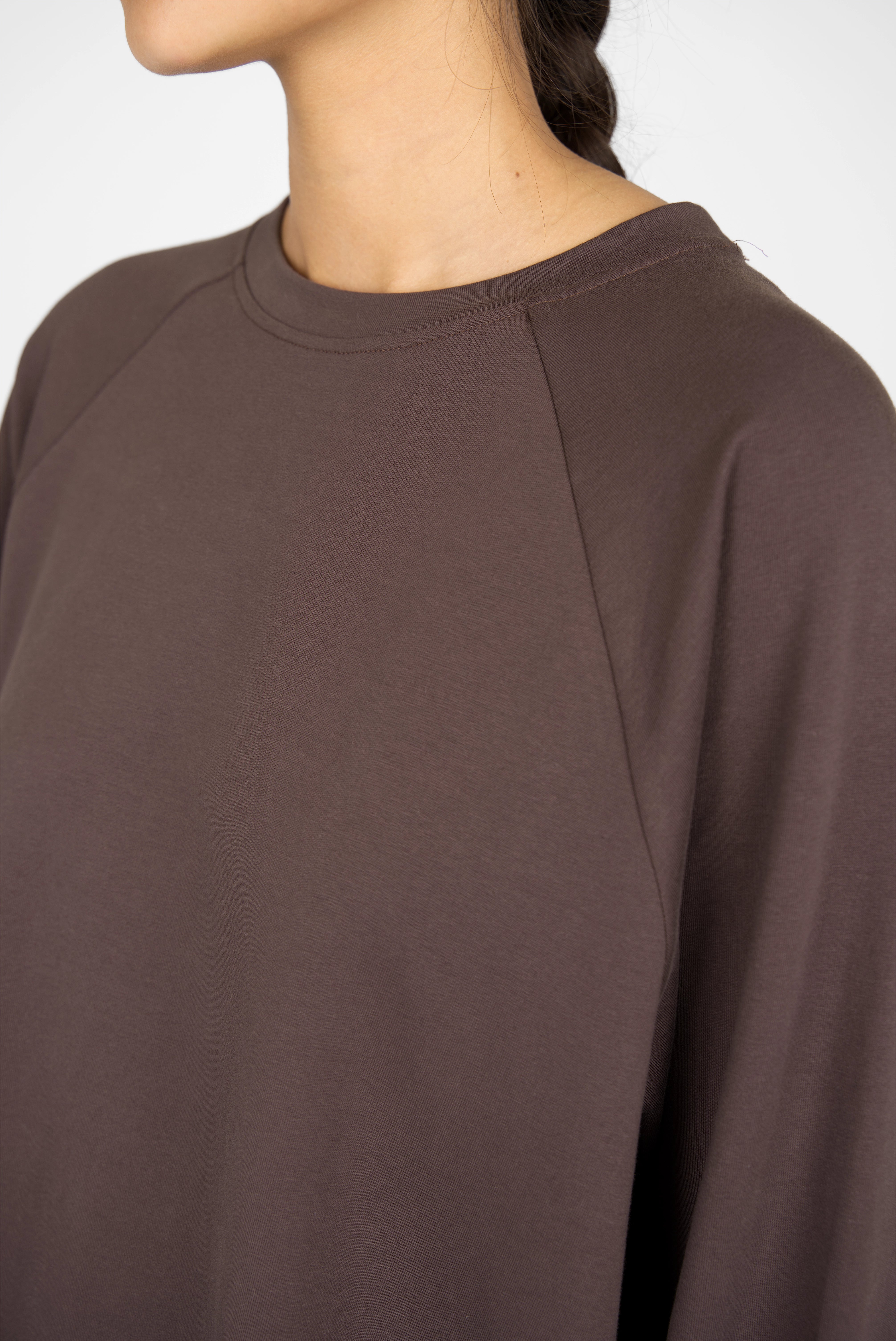 Close-up of a brown GRACEY.K Sweater with round neckline and tonal logo embroidery in oversized fit