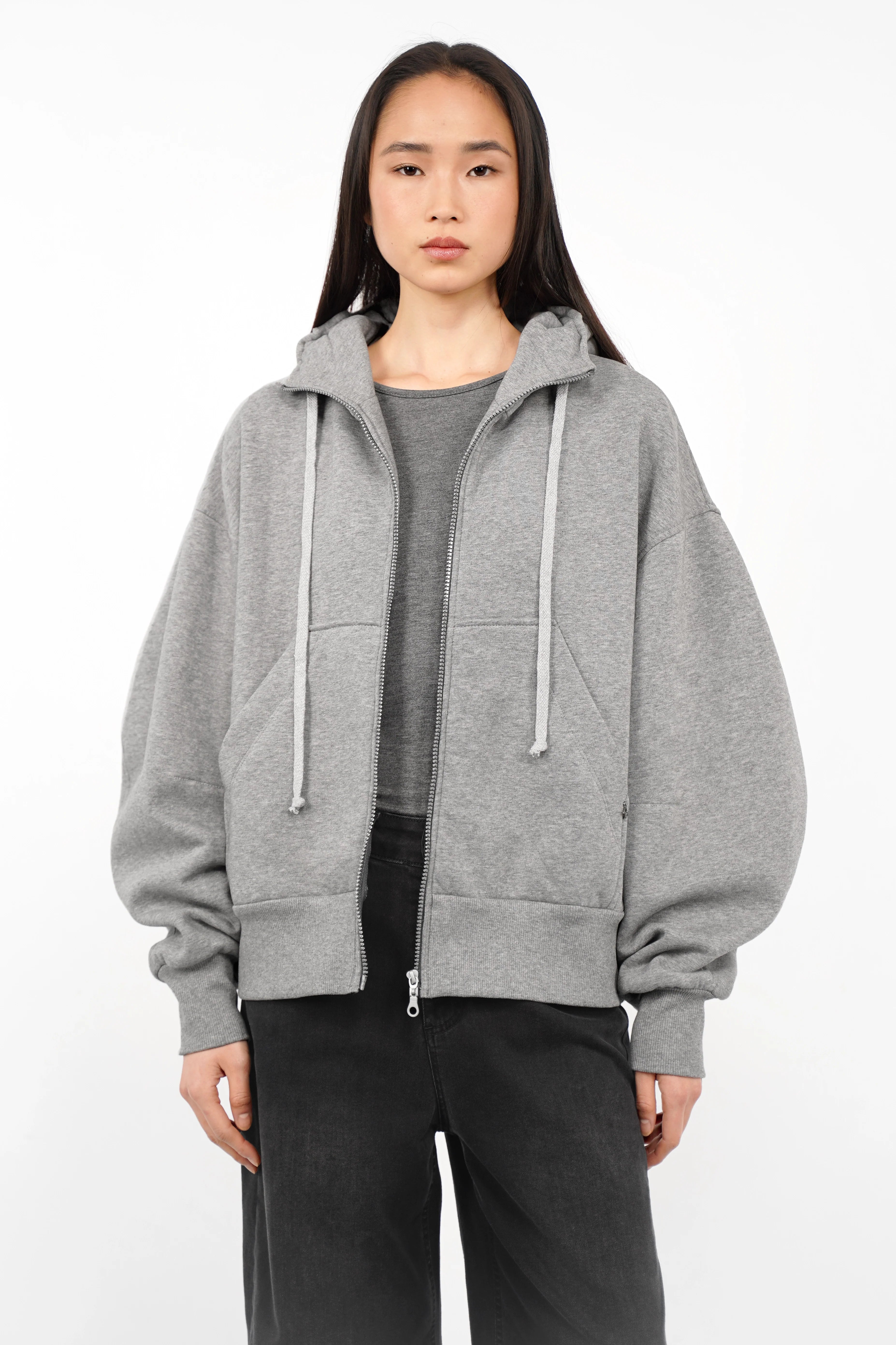 Gray relaxed fit zip-hoodie with oversized sleeves, kangaroo pocket, and drawstring hood