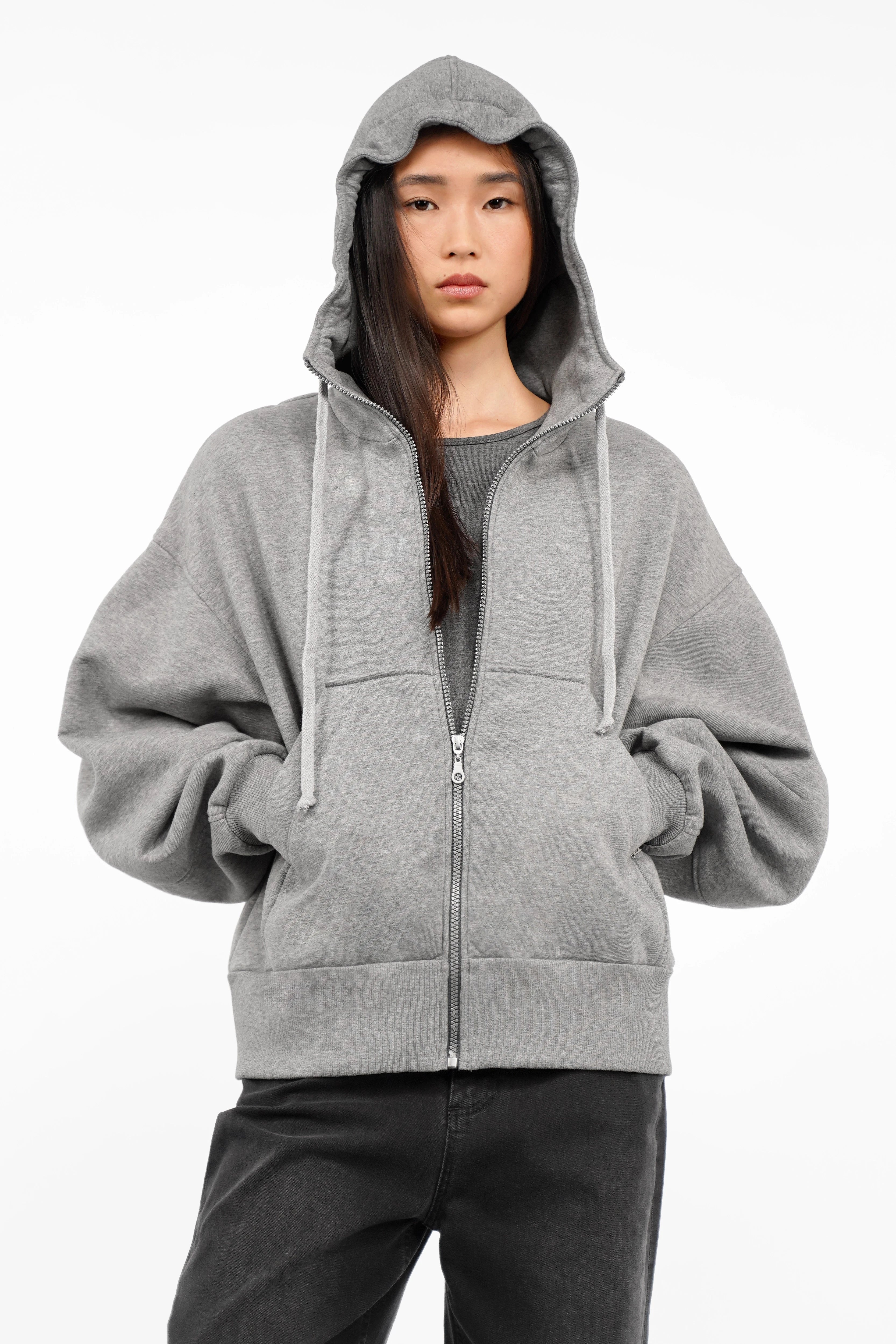 Grey relaxed fit zip-hoodie with oversized sleeves, hood with drawstring, and kangaroo pocket