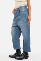Lightweight Italian denim baggy jeans with relaxed fit and destroyed wash effects