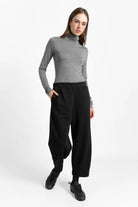 Woman wearing black JOUDY Carrot Jogpant with cropped, tapered fit and side pockets