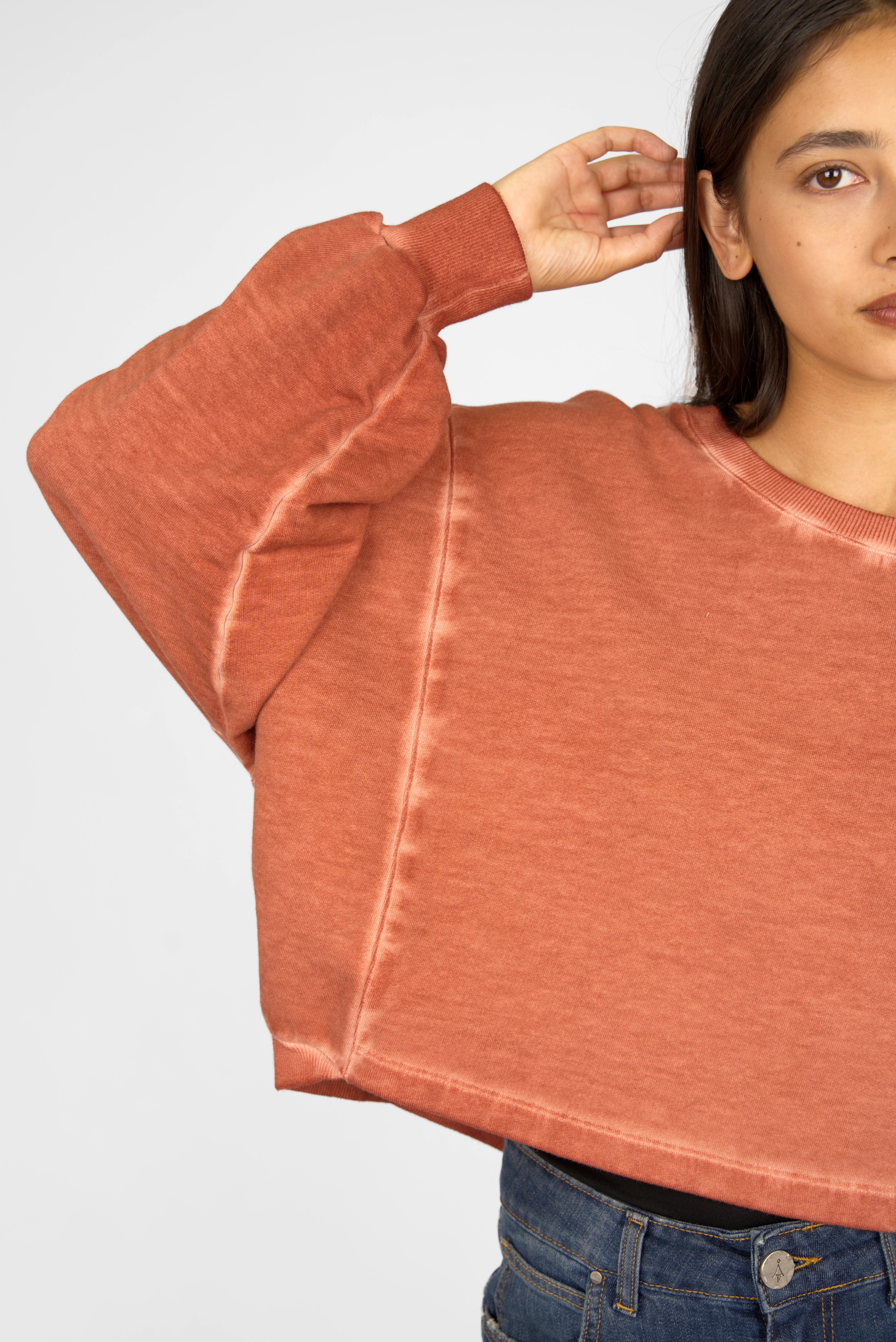 KERY Cropped Sweater in cold-washed cotton with oversized fit, U-boat neckline, dropped shoulders, and cropped length in rust color