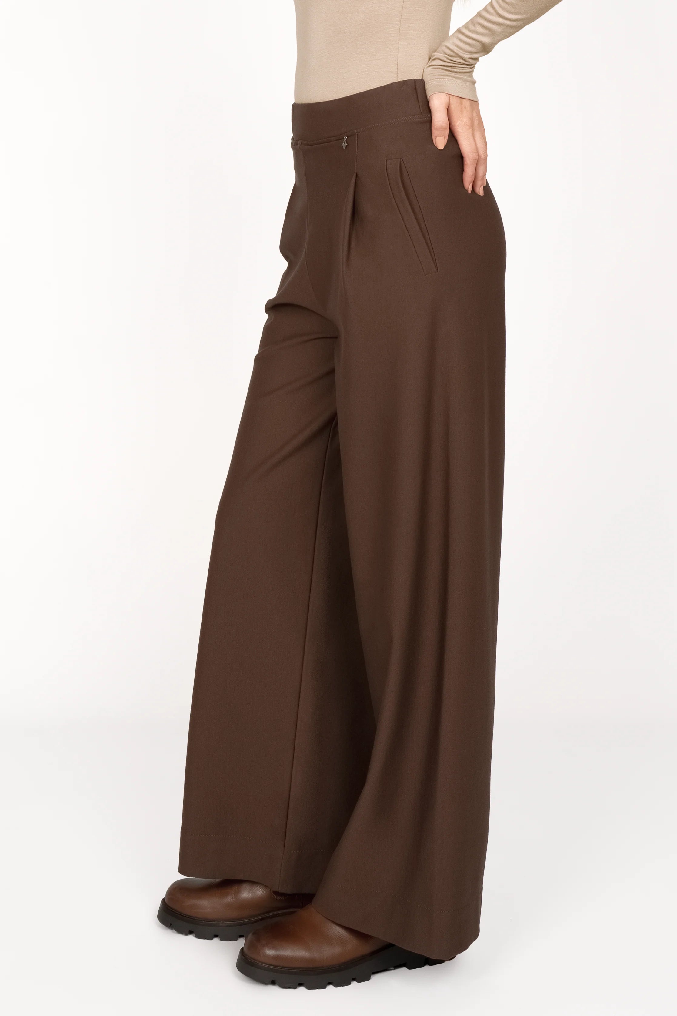 KLARA.K Wide Leg Pants in brown with elastic waistband, subtle pleats, side pockets, and relaxed fit.