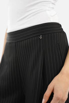 Woman wearing LARA.K Wide Leg Pants in lightweight, wrinkle-resistant fabric with elastic waistband and side pockets