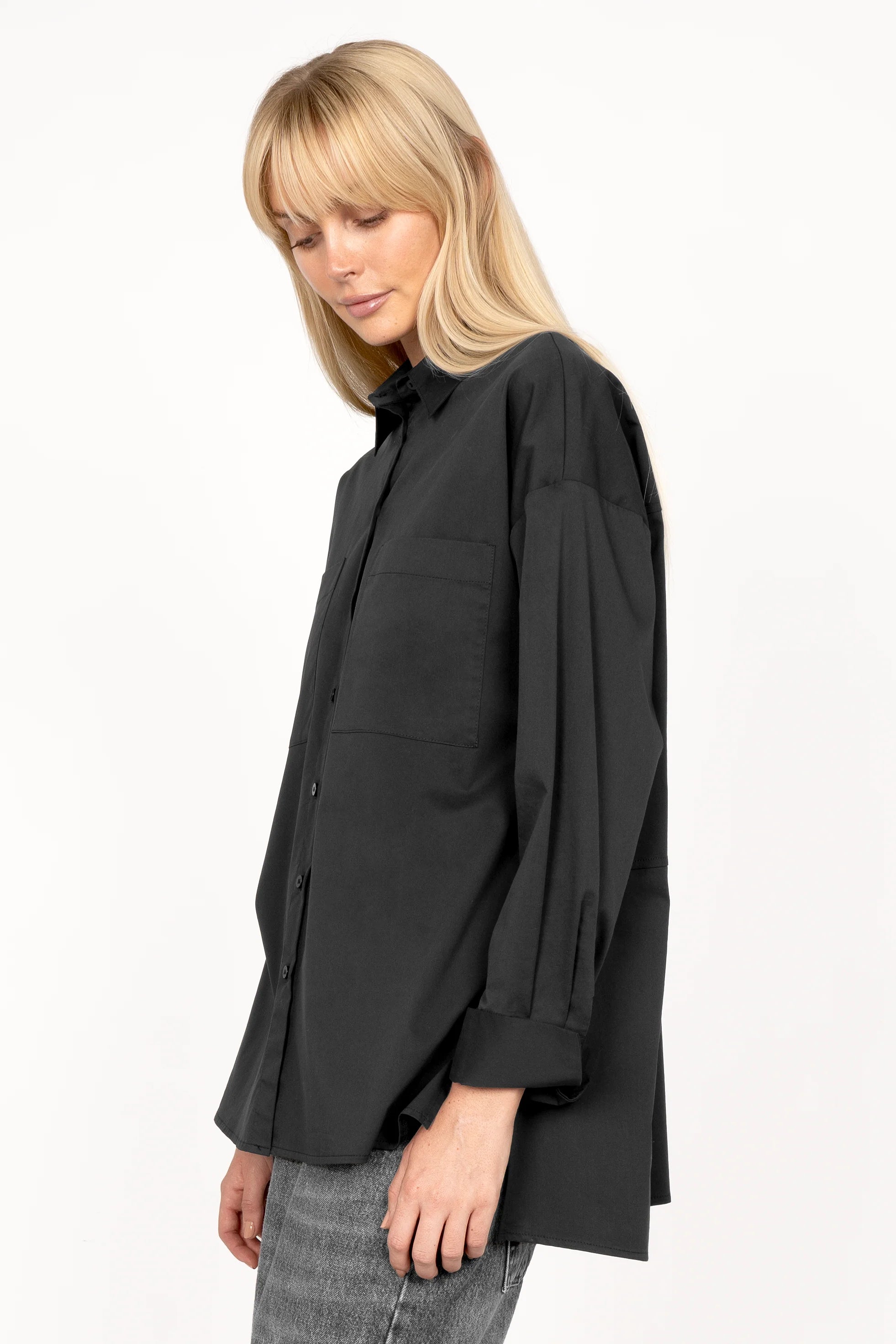 Black LEA.K loose fit cotton poplin blouse with chest pockets and extended back hem.