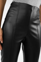 Close-up of black LIMGARD Flared Eco-Lederhose with high-waist and vertical stitching detail