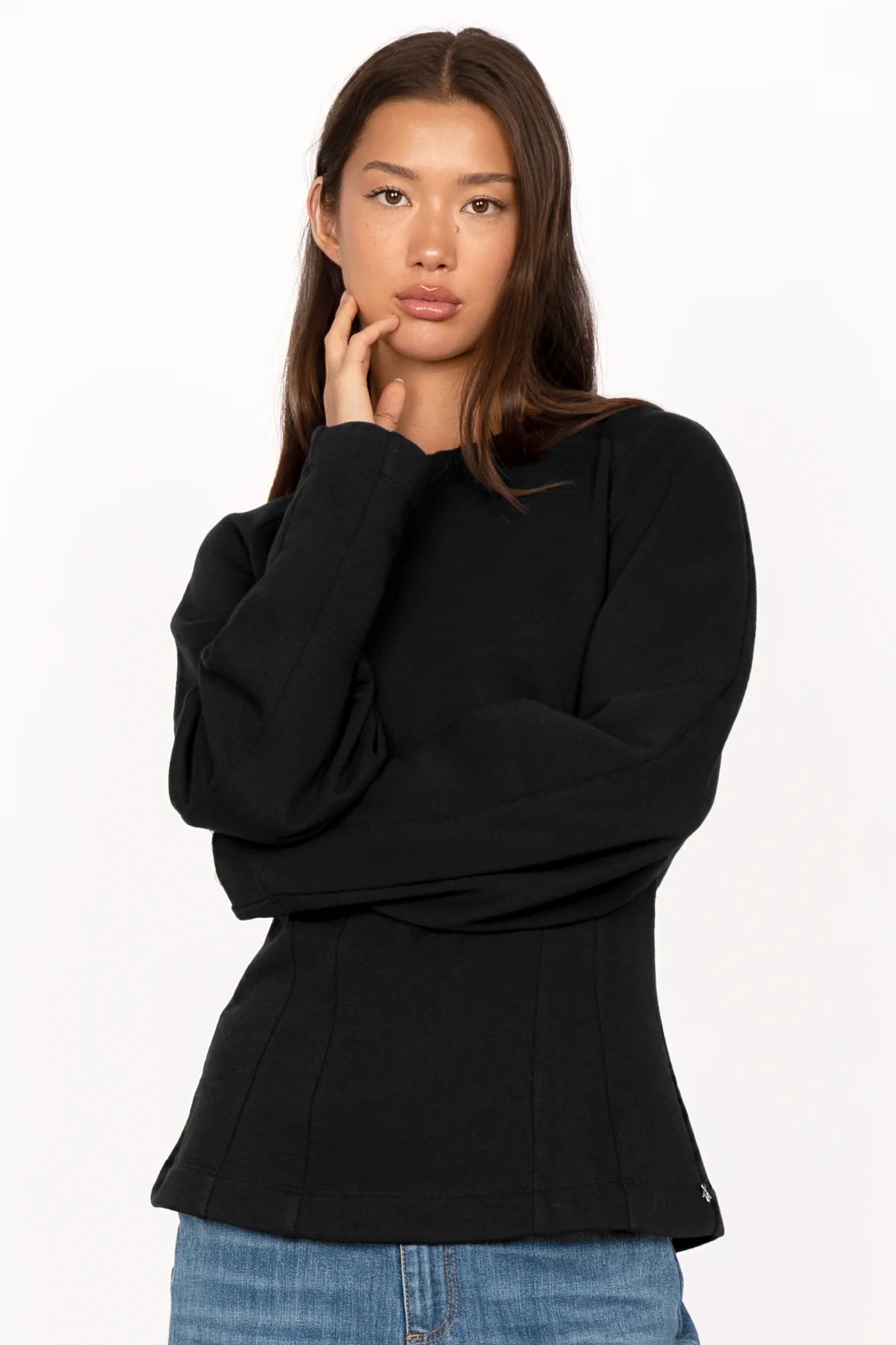 Black MALVEA Sweater with structured seams and relaxed fit on female model