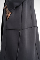 Close-up of dark grey MANEY Sweatmantel with brushed jersey fabric and exposed seam details