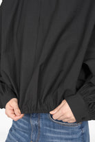 Black MILLIE Crinkle Bluse with balloon sleeves, elastic waistband, and buttoned cuffs in cotton blend fabric