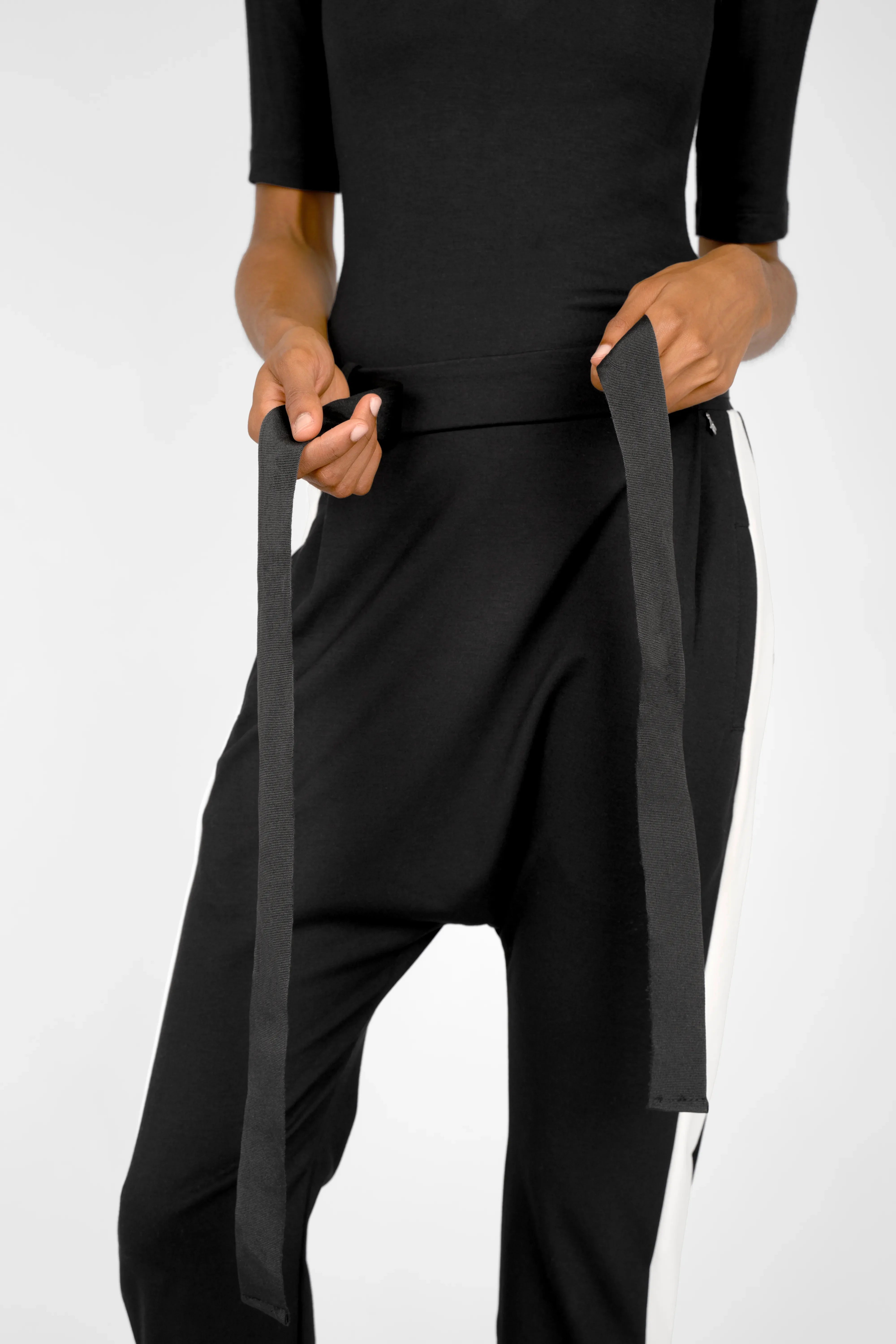 Black MYRAN tapered sweathose with contrast side stripes and adjustable tie belt.