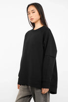 NAIRA Cozy Sweater black soft brushed cotton A-line relaxed fit women’s pullover with rounded hem and raglan sleeves