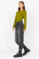Woman wearing SAIKA Relaxed Tapered Hose in denim-look soft textured cotton with relaxed fit and gradient wash.