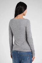 Back view of woman wearing grey SUJIN Longsleeve made of soft cashmere blend with slim fit and ruched sleeves.
