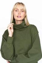 SYNNI Kleid in olive green viscose-jersey with relaxed fit and high collar