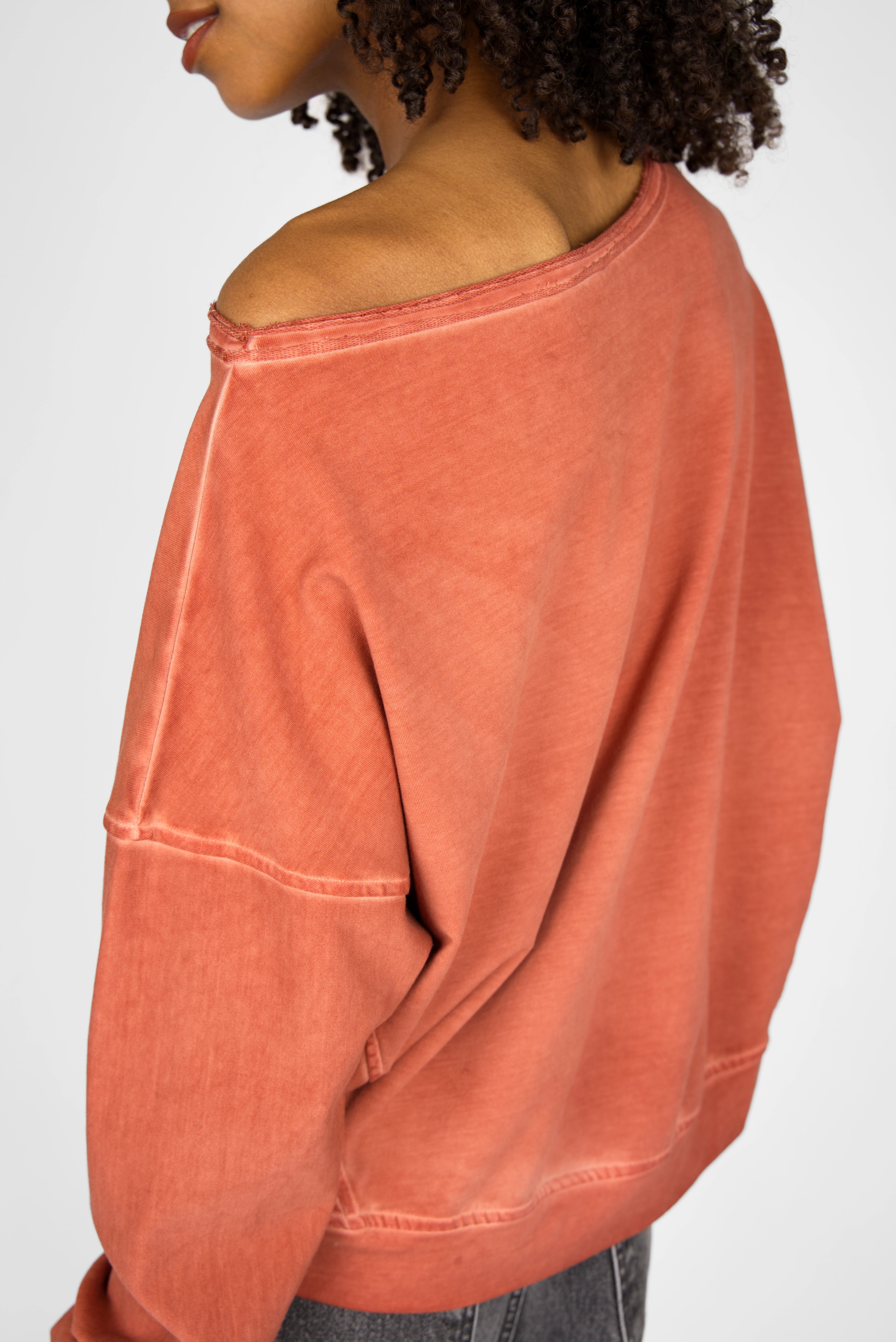 TIMAJ Revive One Shoulder Sweater in washed orange with loose fit and wide neckline showing one shoulder