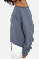 One Shoulder Sweater with wide neckline, soft fabric, extended cuffed sleeves, loose fit, longer back hem