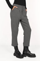 Gray TINKE Hose Cropped fit pants with light pleats, cropped length, and side zipper worn with black boots and top