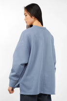 VIOLE Cozy Sweater in blue with A-line fit, brushed soft cotton, open back seam, and side slits.